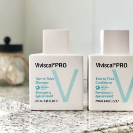 Two bottles of viviscal pro hair thickening shampoo.