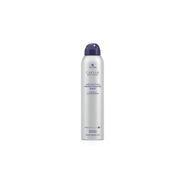 A can of hair spray on top of a white table.