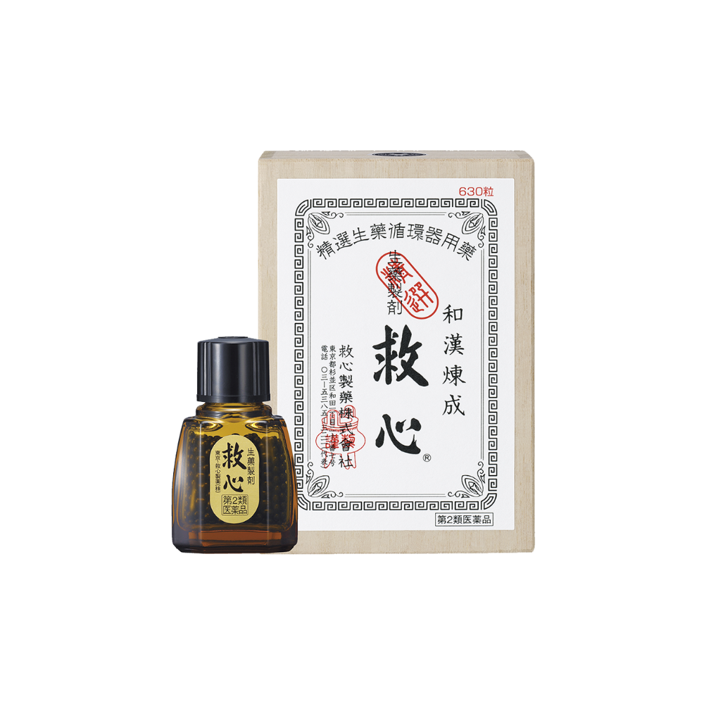 A bottle of oil sitting next to a box.