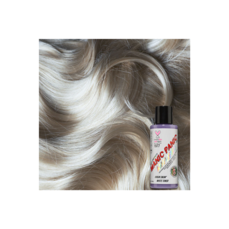 A bottle of hair color next to some white and brown hair.