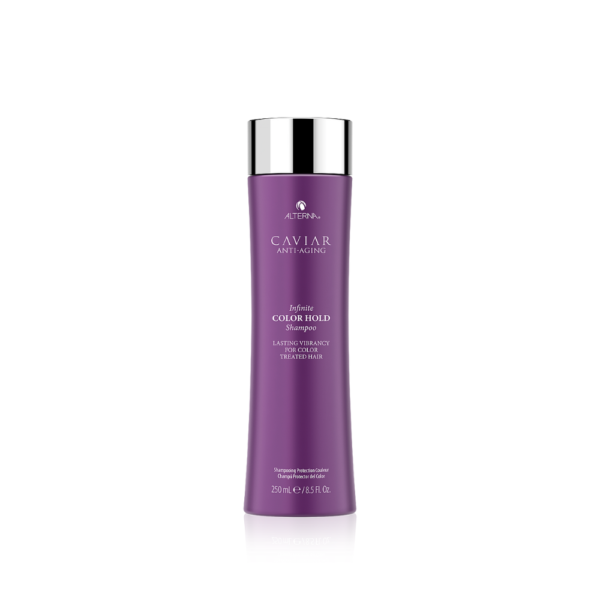 A purple bottle of hair conditioner on top of a white table.