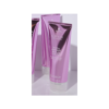A purple tube of lotion sitting on top of a table.