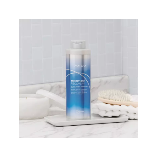 A bottle of shampoo sitting on top of a counter.
