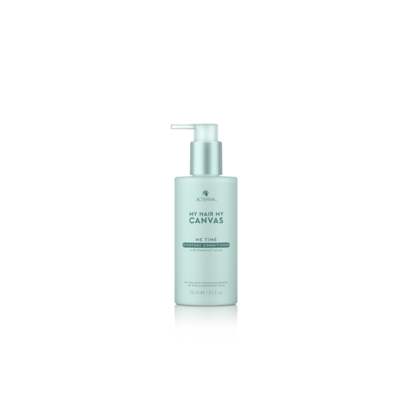 A bottle of facial cleanser on top of a white table.